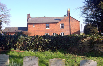 College Farmhouse seen from the churchyard March 2011